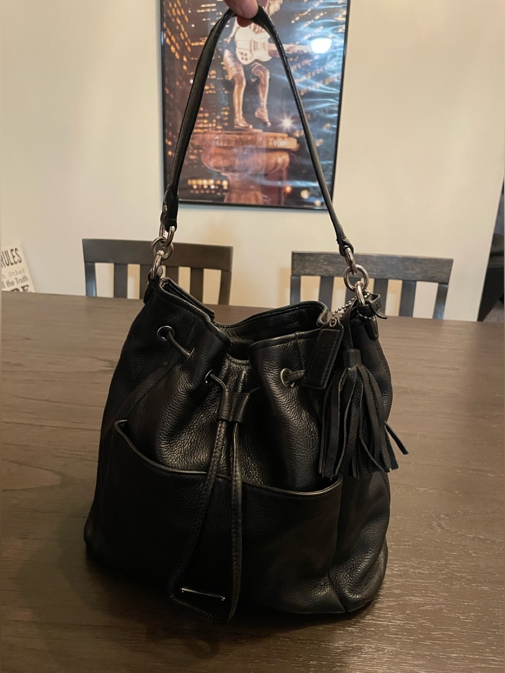 Coach Avery Park black pebbled leather drawstring hobo shoulder bag.